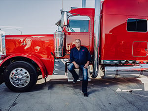 Man sitting on red truck